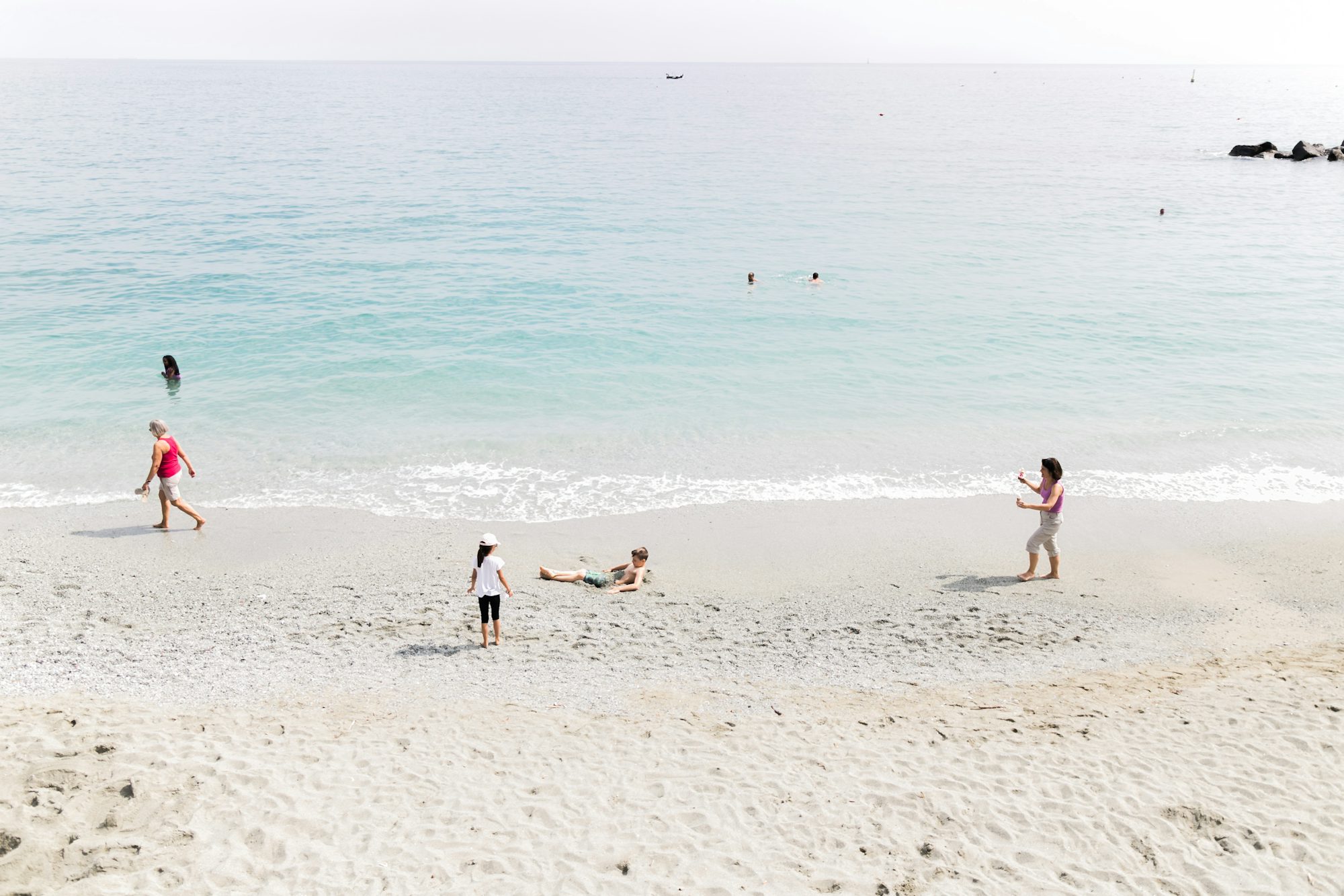 Family enjoying a beach day on the Mediterranean coast